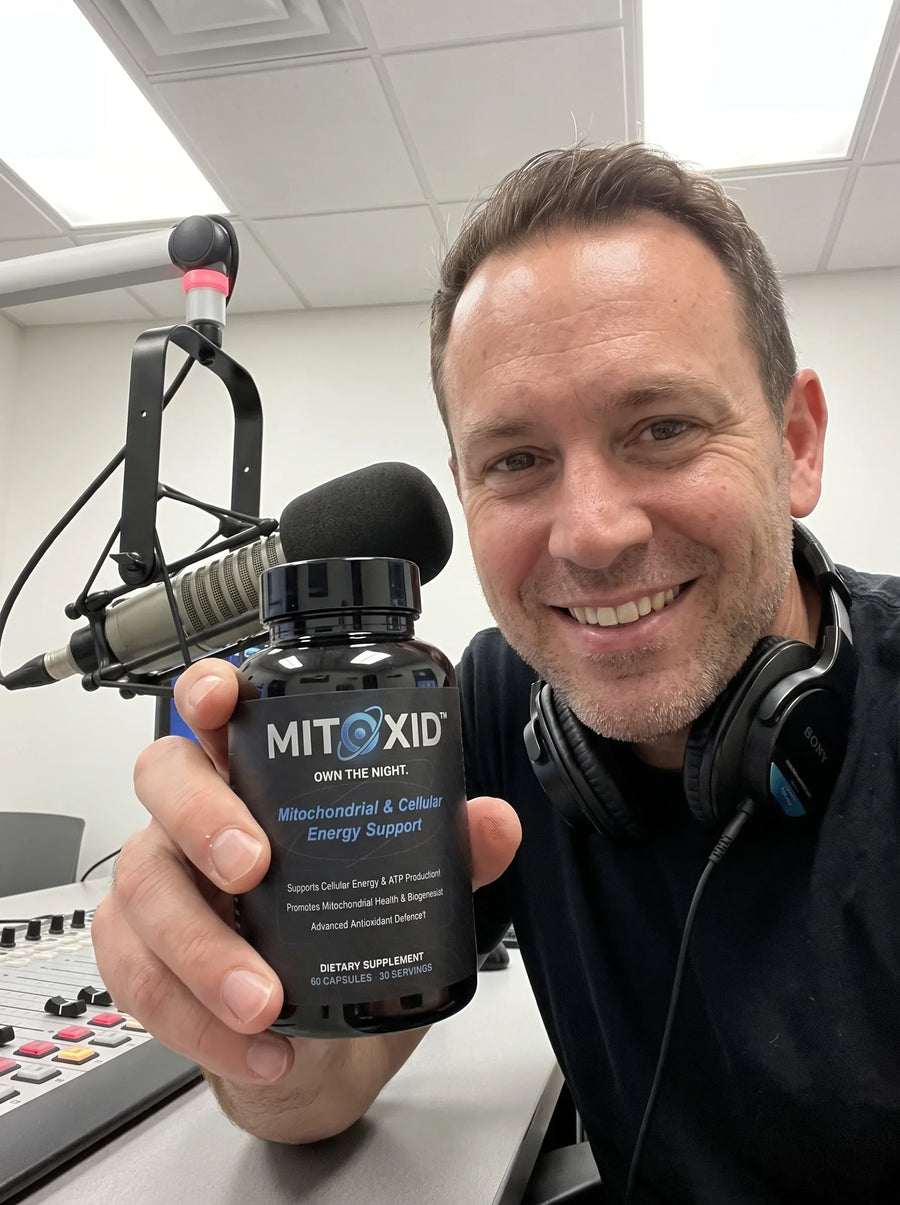 Customer photo: an overnight radio presenter at the studio desk with the Mitoxid bottle