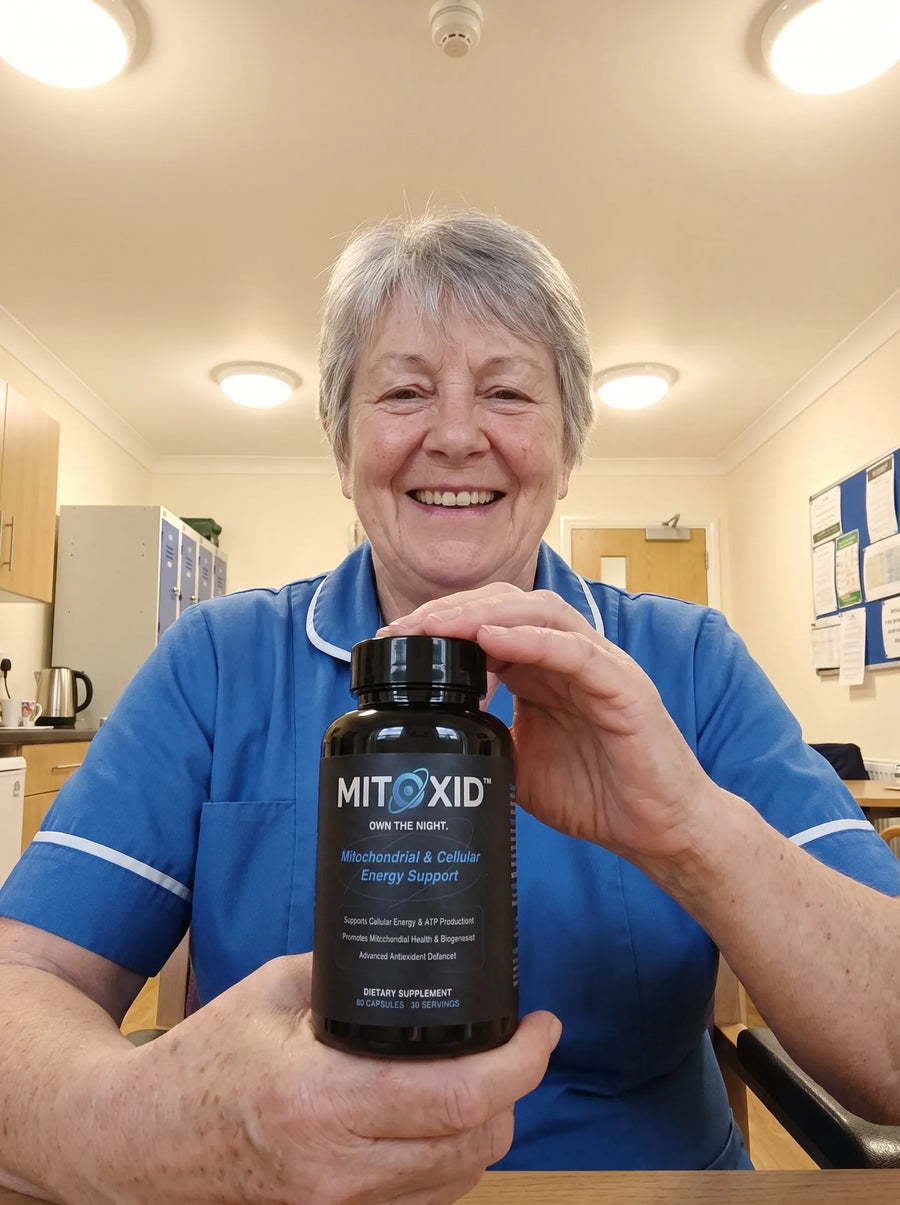 Customer photo: a care home carer in the staff room holding the Mitoxid bottle